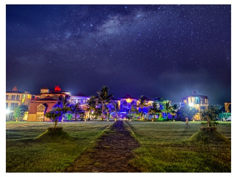 RRK Resort under a starry milky way sky with illuminated facade